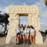 Birthright Israel participants standing in front of a statue in Jaffa, Israel.