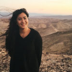 Alix Ablaza in the Negev on a windy day at sunrise on her 2015 Birthright Israel trip