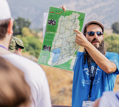 A Birthright Israel tour educator describing a map of Galilee in northern Israel