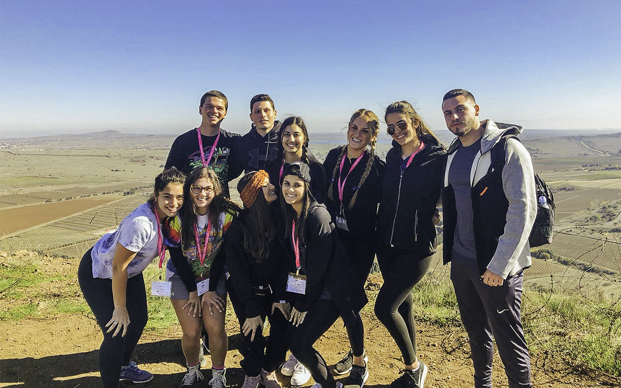 2019 Birthright Israel Mifgash Alumnus Snir Lasri with members of his group in the Golan Heights