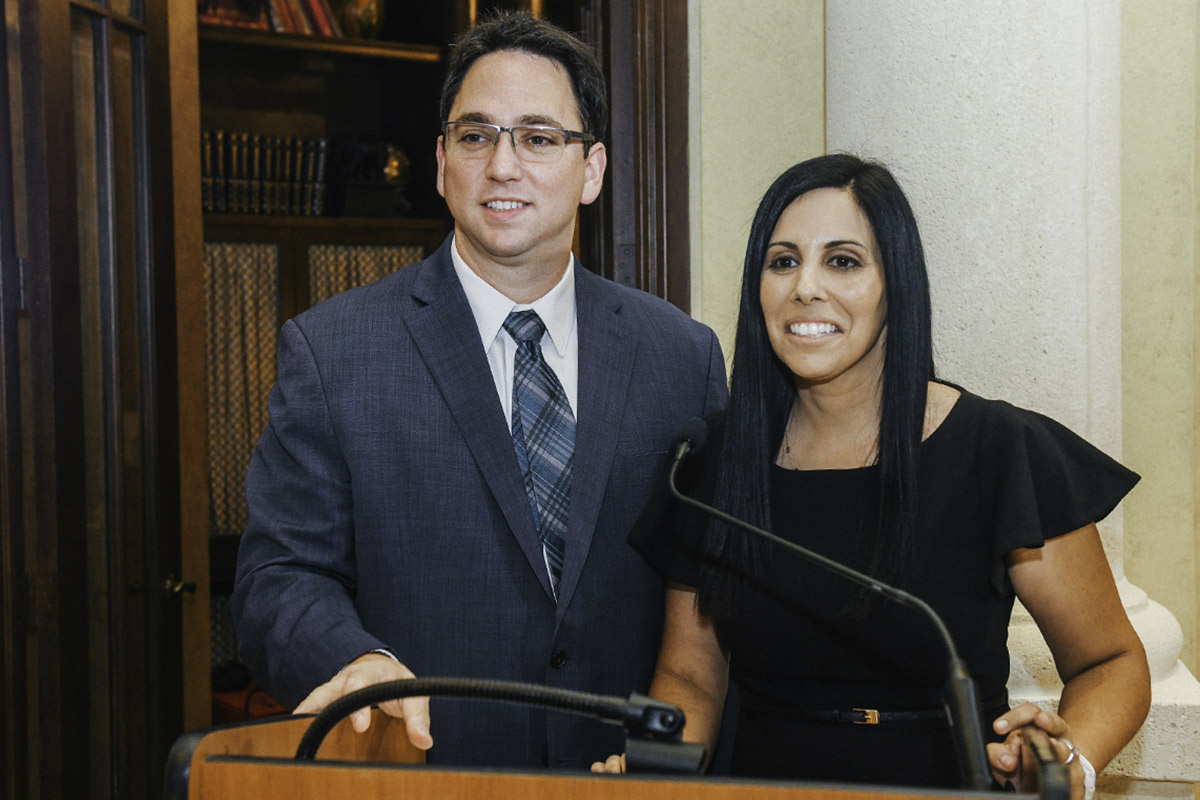 Holly & Chad Sokoloff standing at the podium at a Birthright Israel Foundation event