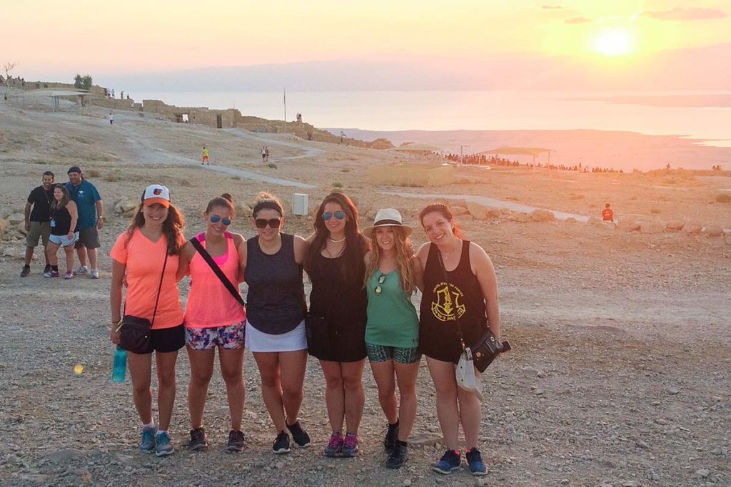 Hailey Desser on top of Masada at sunrise with her 2015 Birthright Israel group