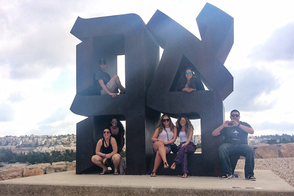 Hailey Desser with her 2015 Birthright Israel group on the Ahava sculpture in Jerusalem
