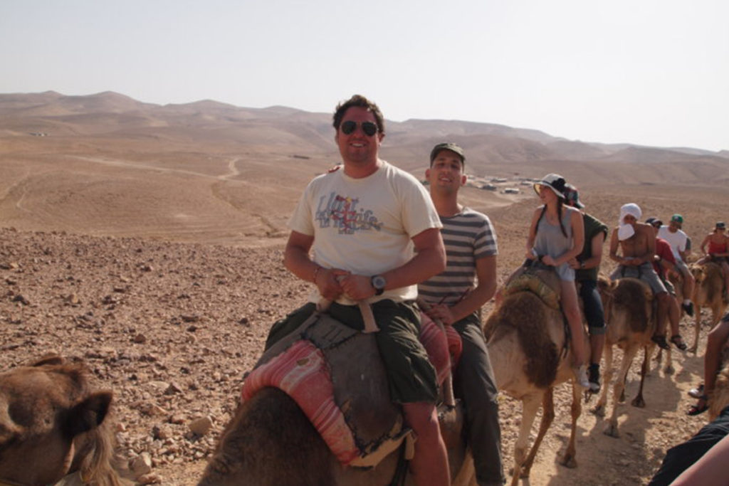 Aaron Leff riding camels on his Birthright Israel trip